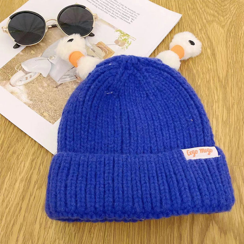 Helendav kootud müts